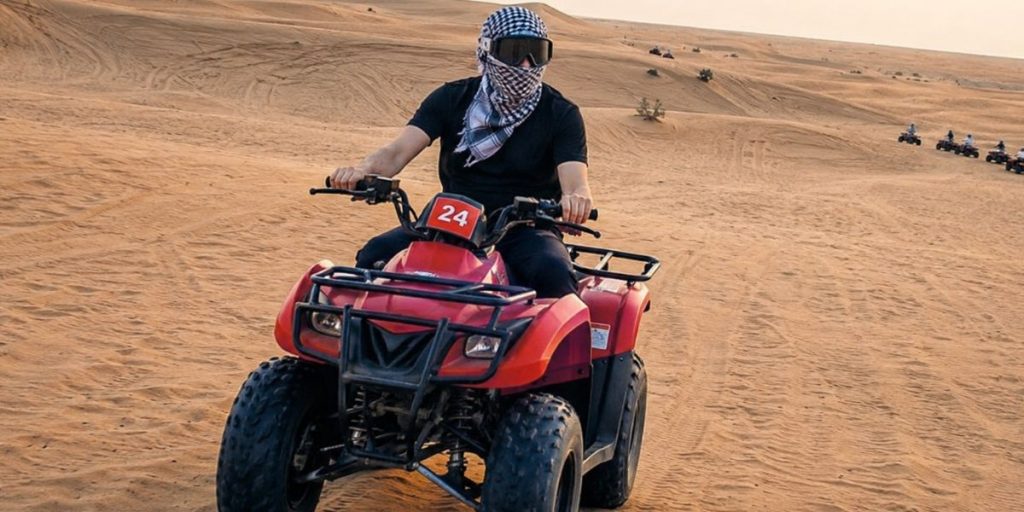 How to ride a quad bike safely on sand dunes in Dubai desert